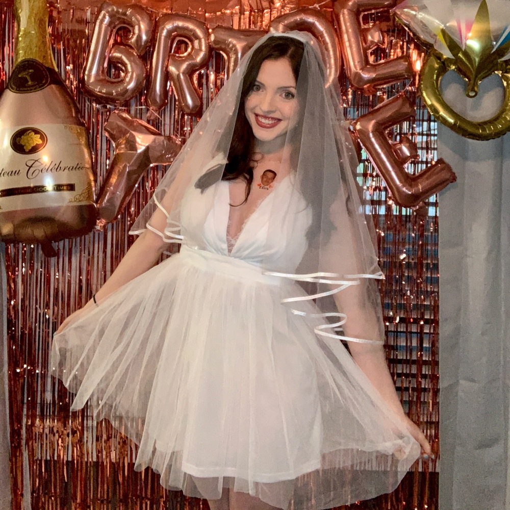 White tulle mini dress with lace detail.